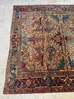 One end of the rug showing detailed border design