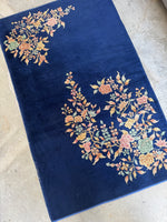 Small Art Deco Chinese rug in very nice condition with open field design.
