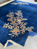 Glowing antique Chinese Art Deco rug with plush underfoot feel and floral accents.