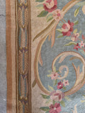 Baby blue Aubusson tapestry rug with warm oatmeal, ivory, and pistachio green accents.