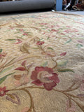 Antique French floral tapestry with soft pastel colors and detailed curvilinear branches.