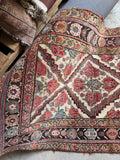 Vegetable-dyed Persian Bakhtiari rug displaying rose pink, blush, and French blue accents.