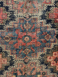 5x6 faded tribal area rug showing authentic wear, exposed foundation, and antique character.