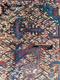 Angular motifs and an interconnected pattern against an ivory ground 