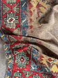 Antique Caucasian hallway rug, handmade vegetable dyed wool runner with geometric motifs, vibrant red and blue borders, and historic craftsmanship.