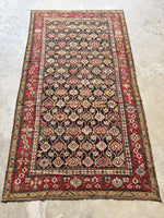 Tribal Caucasian rug featuring lattice pattern and alternating colors.
