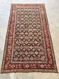 Tribal Caucasian rug featuring lattice pattern and alternating colors.