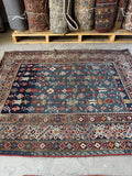 Antique Caucasian tribal rug with bold pattern and beautiful shades of blue.