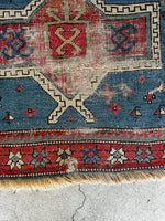 Antique rug with whimsical scorpion motifs woven for protection.