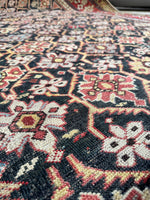 Handwoven antique Caucasian rug crafted with natural vegetable dyes.