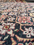 Handwoven antique Caucasian rug crafted with natural vegetable dyes.