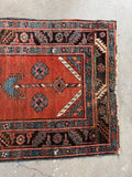 Vintage tribal runner from the Caucasus mountain region, crafted in the early 1900s.