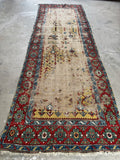 Vintage Caucasian runner, authentic hand knotted wool hallway rug featuring vegetable dyed colors, tribal symbolism, and a soft floppy handle.