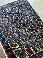 Ivory motif detail on Caucasian rug.