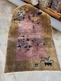 Antique Chinese Art Deco rug from the 1920s with lavender field and camel color border.