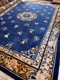 Antique Chinese Peking blue rug 13x19 laying flat showing the complete blue field, center medallion, and gold butterfly border.