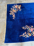 One end view of Antique Chinese rug from the 1930s with Art Deco floral accents.