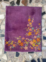 Full view of antique Chinese Art Deco rug with rich purple background.