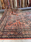 Antique Persian Rug with coral pink abrash, floral medallion-inspired design, and beautifully aged vegetable-dyed wool.