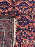 Baluchi wool scatter rug 1900s close-up shot focusing on the underside of rug.