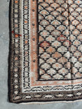 Corner view of century-old featherweight flat weave runner.