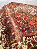 Fine weave antique rug with medallion in medallion pattern on red field.