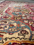 Natural vegetable dyed wool rug featuring horizontal abrash color variations from different dye batches.