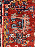 1920s Persian Heriz rug hand knotted with vegetable dyed wool and professionally protected edge.