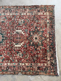 Antique tribal Persian runner with healthy compact pile and long narrow hallway friendly proportions.