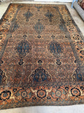 Hand knotted Persian rug from Bibikabad featuring large scale medallions and subtle abrash.