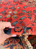 Petite floral Persian scatter rug crafted from durable vegetable dyed coral wool.