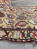 Late 19th century Caucasian scatter rug with rare yellow ground, tribal paisley design and authentic antique wear.