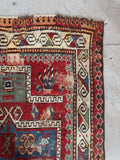 Antique prayer rug with geometric mihrab, hand knotted tribal wool rug in warm red.