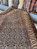 Antique Persian runner, authentic 1920s Bakhtiari wool rug featuring a dark ombré lattice field, ivory borders, and geometric tribal motifs.