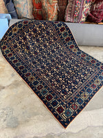 Handwoven antique Caucasian rug texture.
