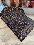 Handwoven antique Caucasian rug texture.