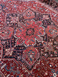 Large antique Heriz rug with starburst central medallion and luminous wool.