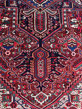 Vintage Persian wool rug. Large Heriz area rug with geometric medallion, serrated leaf motifs, and richly detailed floral artwork.