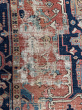 Closeup of border and field transition in antique Persian Heriz rug.