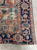 Corner detail showing authentic wear on antique Persian Heriz rug.