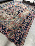 Antique Persian Heriz rug circa 1900 with oversized central medallion.