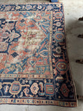Antique Persian Heriz rug floor ready condition with century old character.