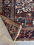 Antique Heriz rug 10x13 angular tribal design low pile worn wool.