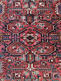 Square Heriz rug highly ornate tribal design layout.