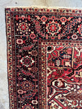 Corner view of hand-knotted Persian Heriz rug with healthy wool and excellent condition throughout.