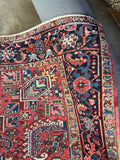 Corner view of early 1900s Heriz rug NW Persia angular tribal design.