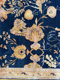 Closeup view of field detail showing floral design across a midnight blue ground.