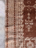1920s Agra wool rug detail displaying intricate multiple border bands and geometric guard stripes.