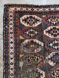 Antique Caucasian Kazak rug showing authentic wear and low pile from age.
