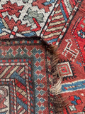 Underside view of Antique Kazak runner handwoven with low wool pile on wool foundation.